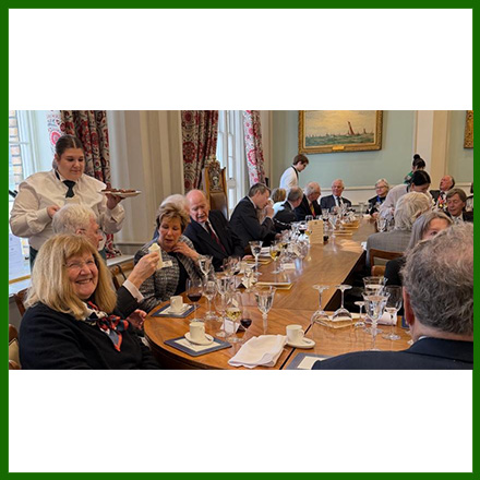 Past Master Dr Kathy Seddon having food with guests